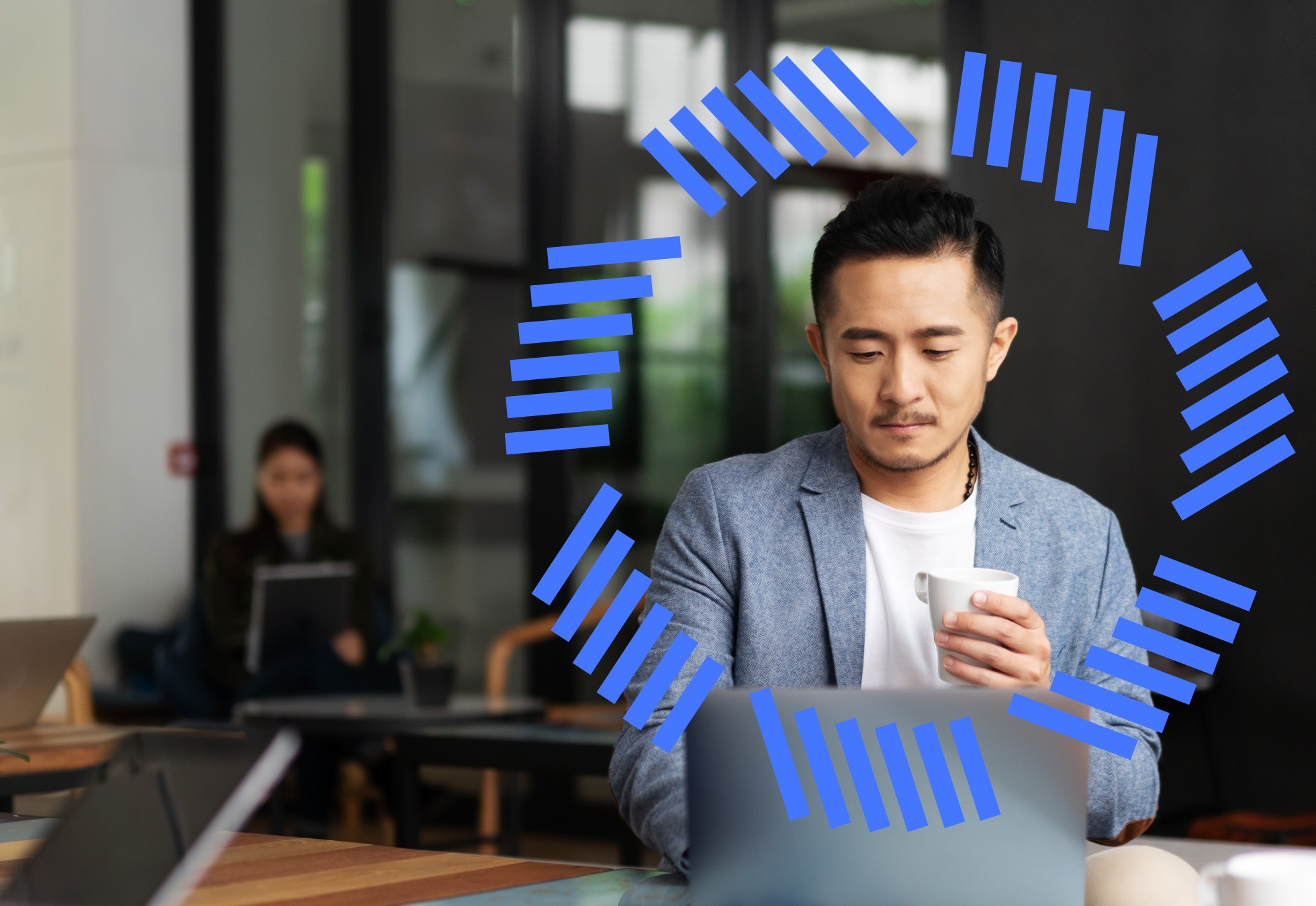 Man on computer with coffee